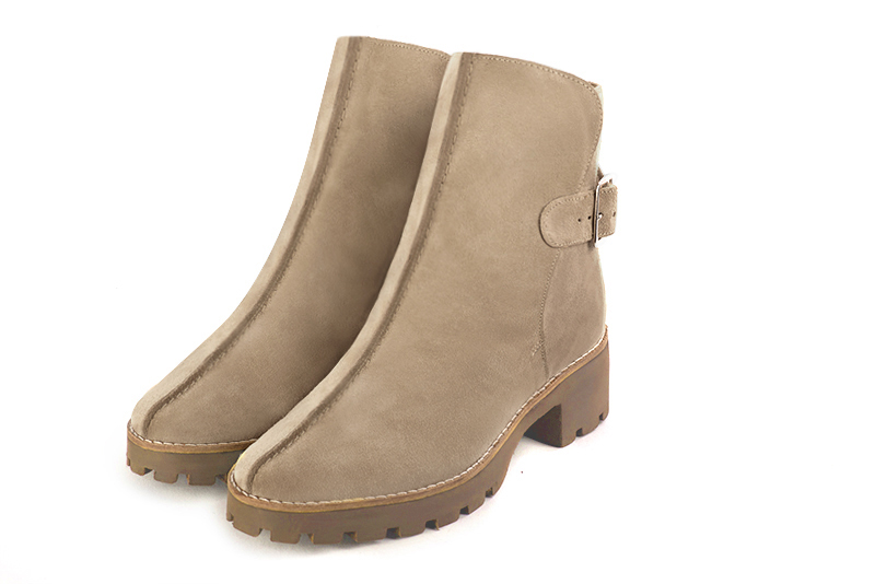 Tan beige women's ankle boots with buckles at the back. Round toe. Low rubber soles. Front view - Florence KOOIJMAN